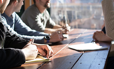 Business meeting at a rustic wooden table