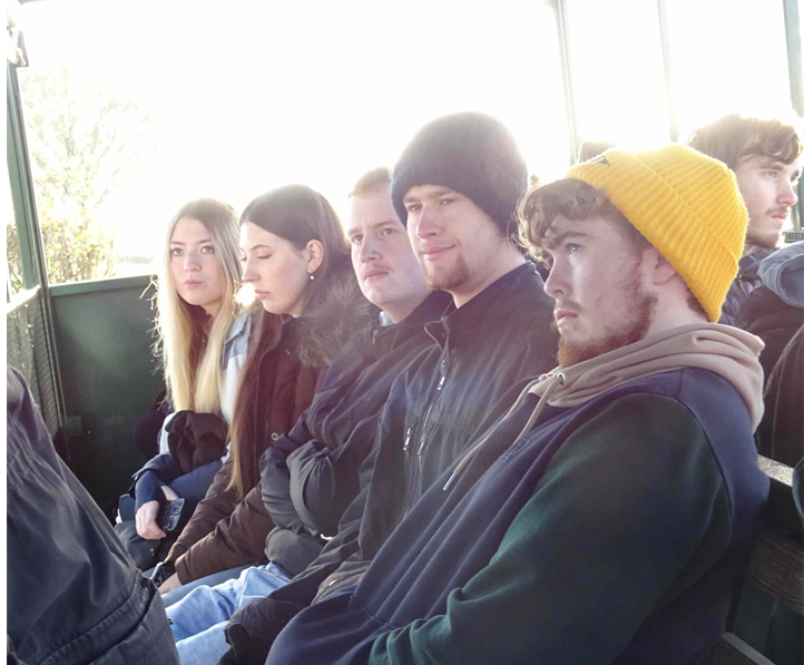A group of students in a rural agriculture setting